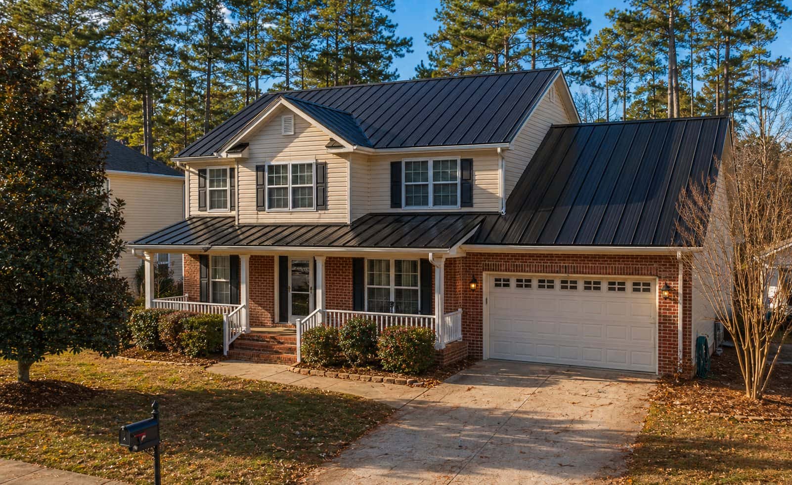 Standing seam metal roof on a two-story Carolina home at golden hour